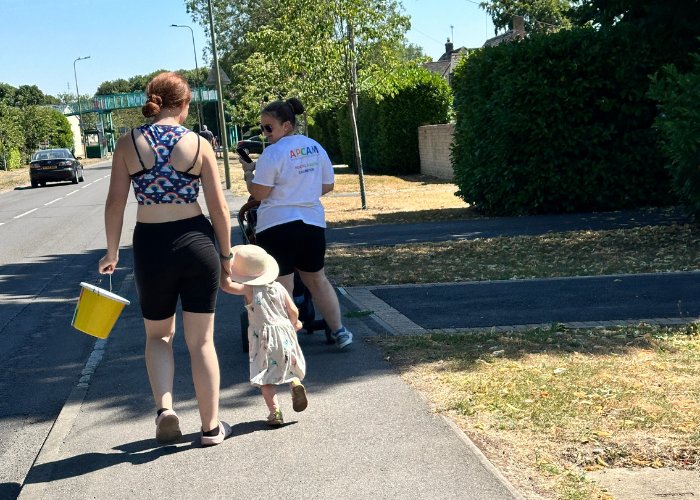 A family collecting for APCAM on a sponsored walk
